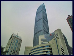 KK100, Shenzhen's tallest building until 2016 (when Pingan Int'l Center will be completed).
It was built in 2011 and also has an observation deck. It stands 442 m tall and has 100 floors. It was designed by Terry Farrell & Partners and contains, restaurants offices a luxury hotel (St Regis) and a shopping mall with the same name.The observation deck on the top has a special architecture with a high atrium and high glass ceiling.